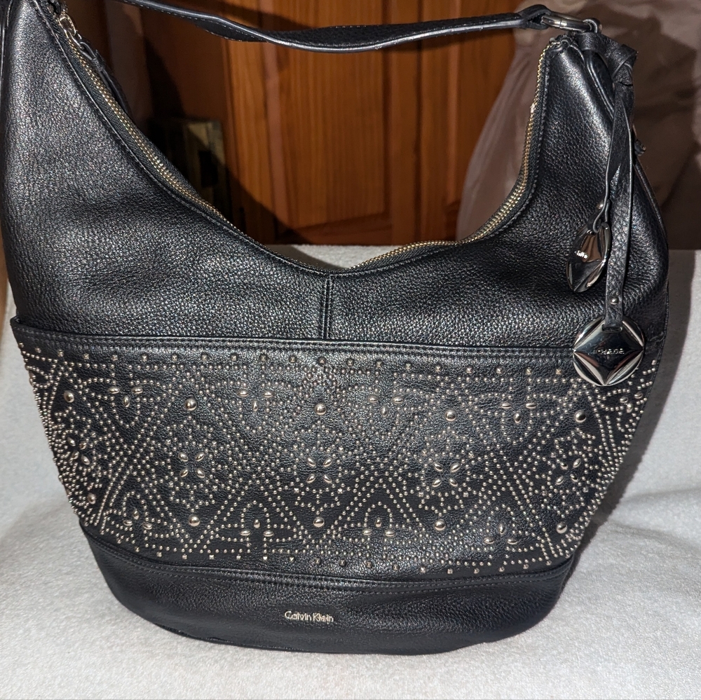 Calvin Klein Avery pebbled studded hobo bag.